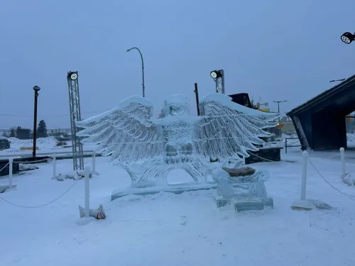 Ice sculpture of a winged figure in a snowy outdoor setting.